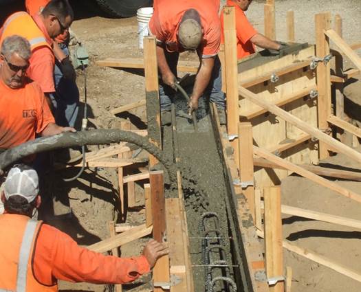 Maintenance workers performing a repair on Tyler Island Rd Bridge.